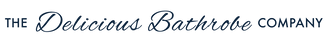 A minimalist logo graphic featuring the text 'THE Delicious Bathrobe COMPANY' in dark navy blue script and serif lettering, centered within a thin dark navy rectangular border on a solid white background.